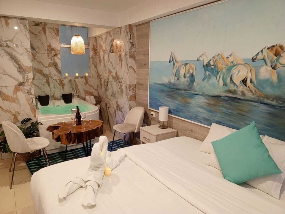 Deluxe Room | Down comforters, iron/ironing board, free WiFi, bed sheets