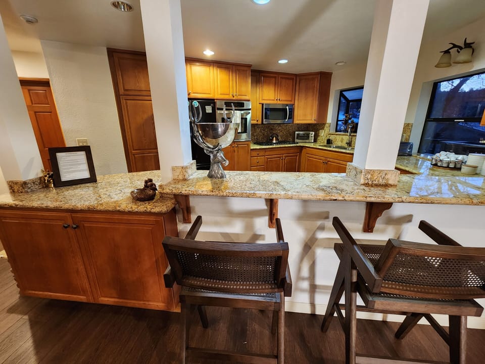 Looking into the Massive Kitchen large enough to easily cook for several families with a 4 seat kitchen bar table and amazing views of the Ski Slopes from the kitchen window!