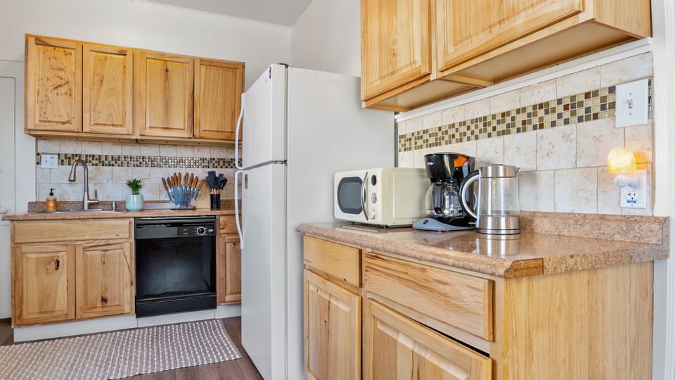 Plenty of Cupboards and Drawers, Coffee Maker, Microwave, and Water Pitcher