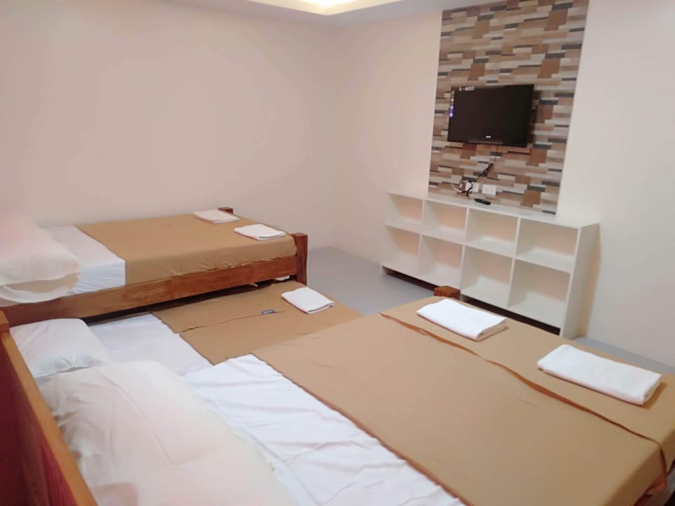 Family Room | Individually furnished, bed sheets