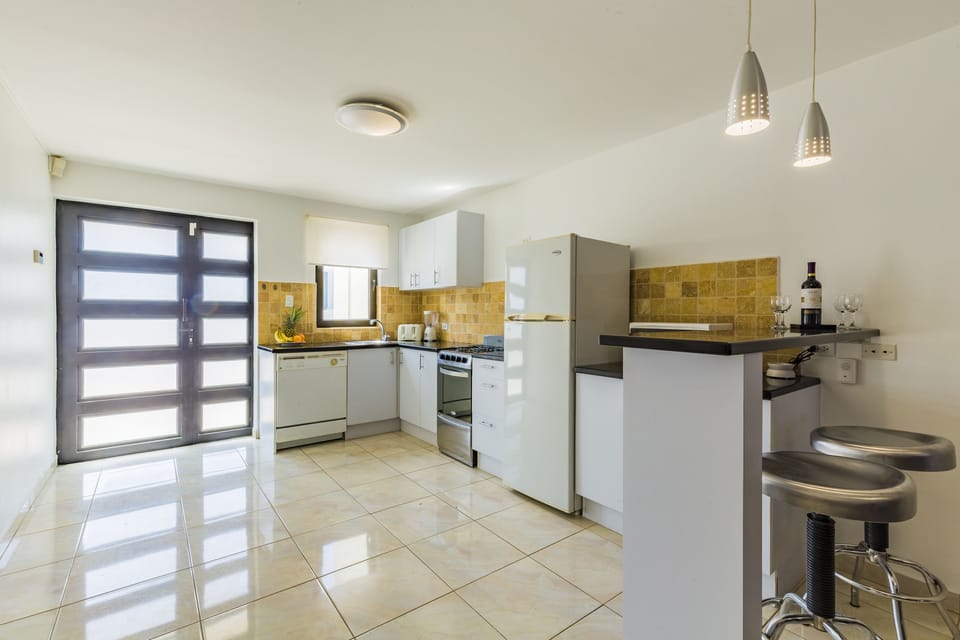 Comfort Apartment, 2 Bedrooms, Poolside | Private kitchen | Fridge, microwave, oven, stovetop