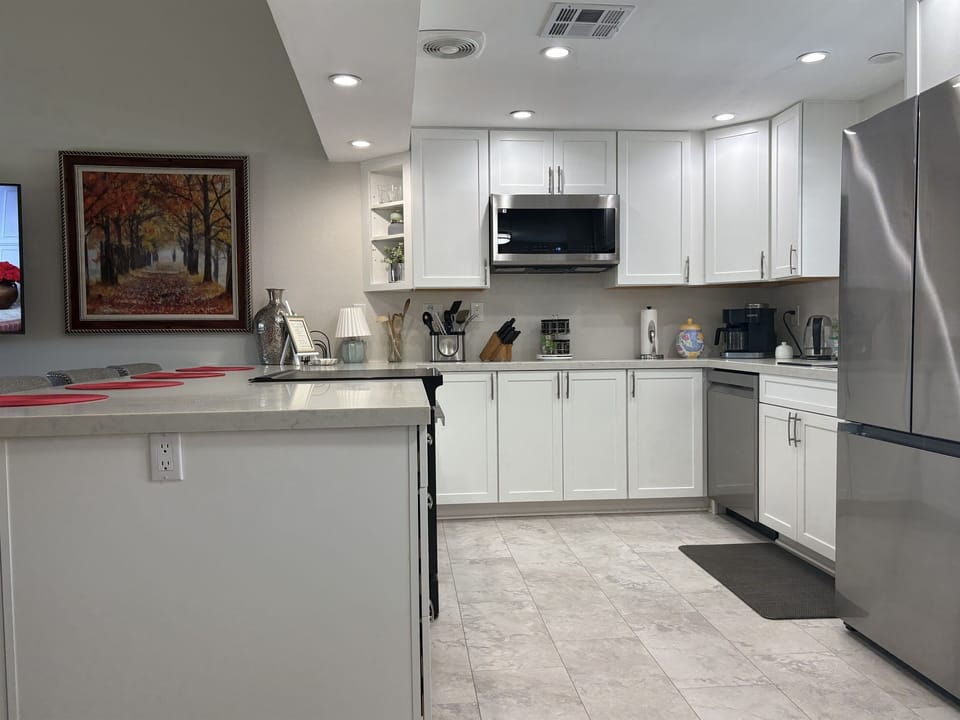 The brand new large kitchen is fully equipped for home cooking  & all your entertaining needs with a BBQ on the patio.