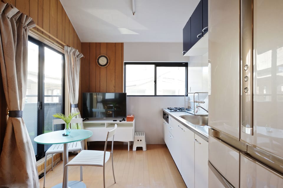 Design Cottage, 2 Bedrooms, 2 Bathrooms, Annex Building | Living area | 42-inch LCD TV with digital channels, iPod dock
