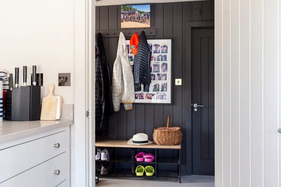 There is a handy boot room to the side of the home for your coats and shoes.