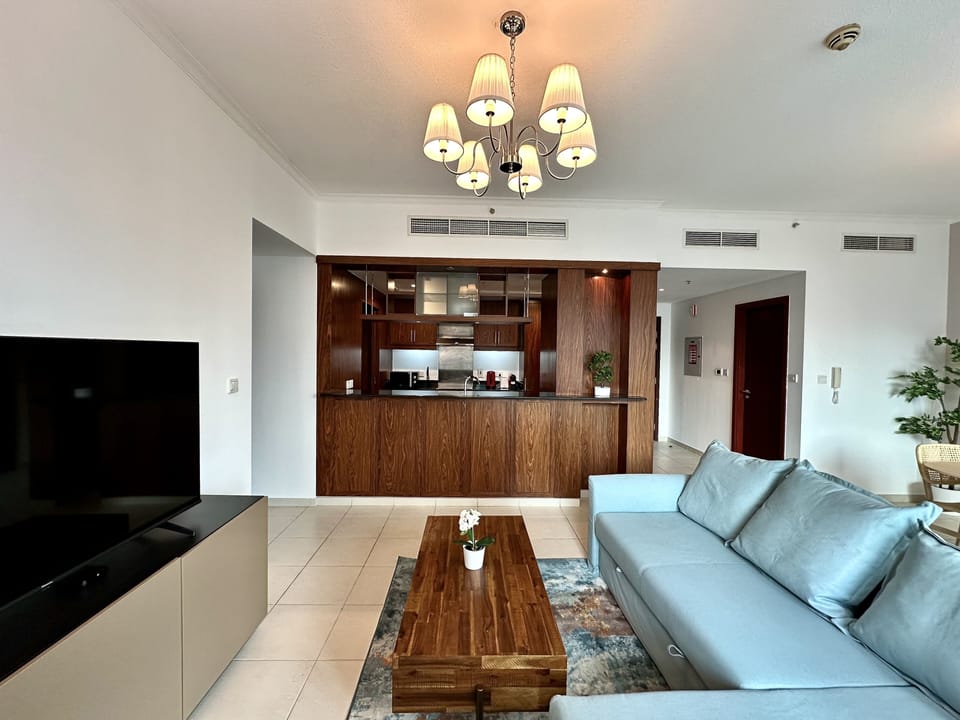 Signature Apartment | Living area | 60-inch Smart TV with digital channels, Netflix, streaming services