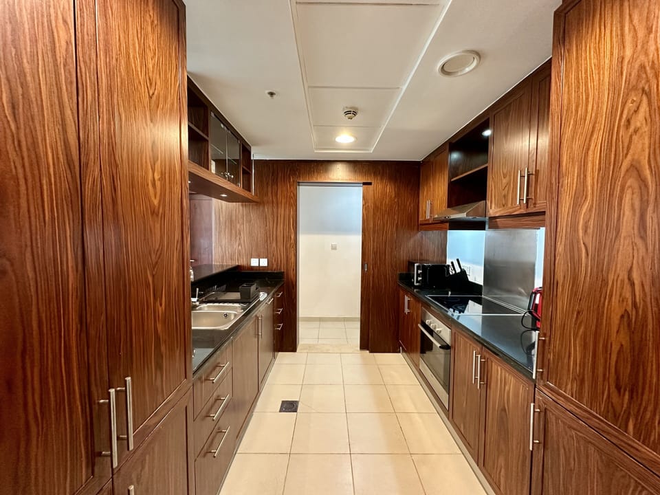 Signature Apartment | Private kitchen | Full-size fridge, microwave, oven, stovetop