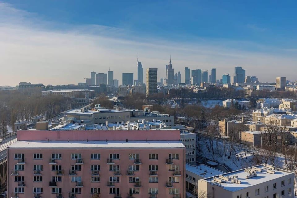 A scenic vista of the urban landscape with the city skyline in the distance.
