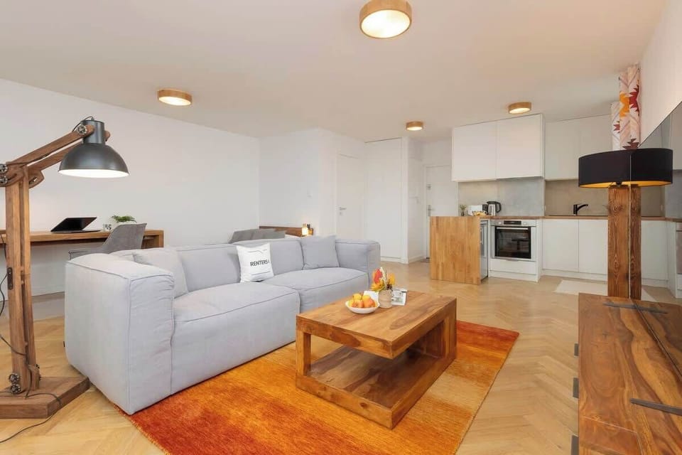 An open-plan layout connecting the living room to the kitchen and dining area.
