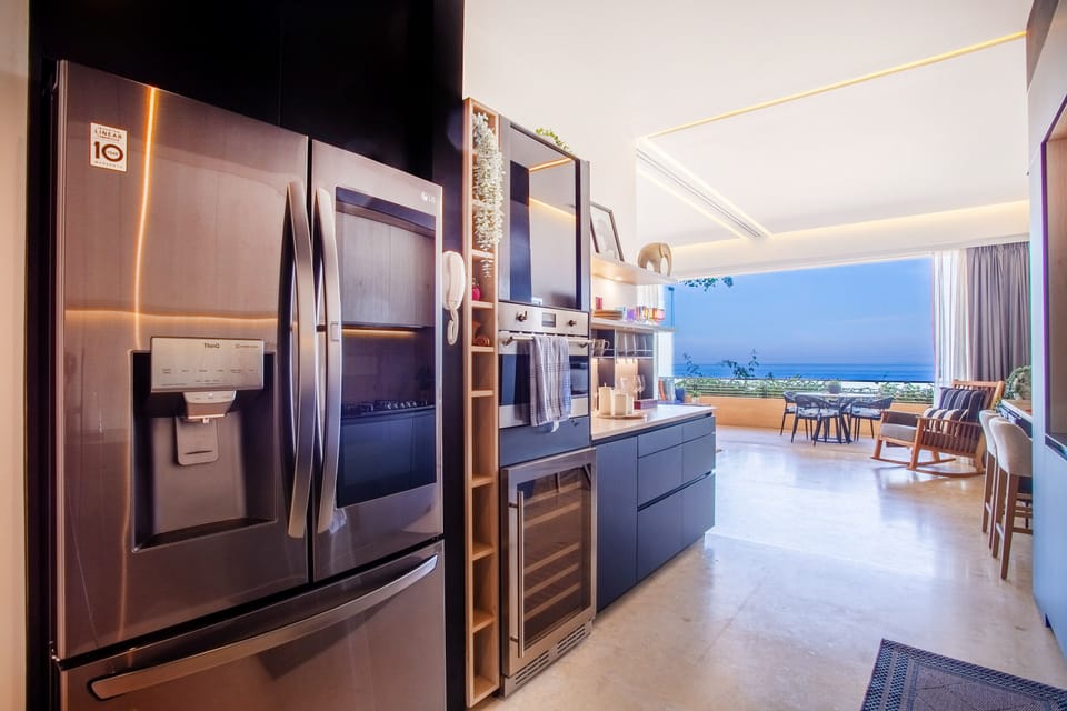 Kitchen amenities include a full-size refrigerator, stove, oven and dishwasher