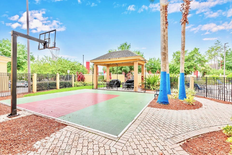 Shoot Some Hoops On The Outdoor Basketball Court Surrounded By Palms