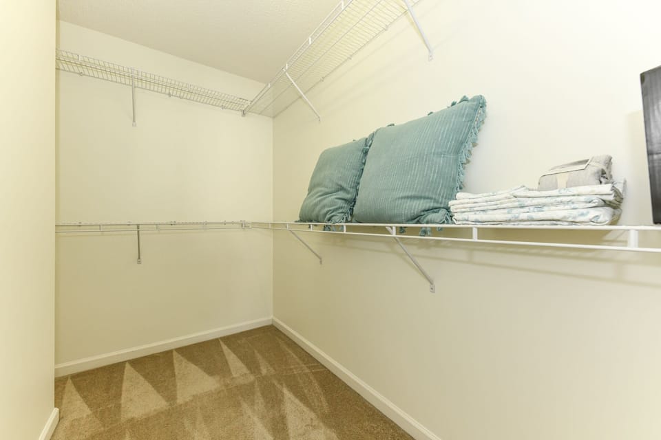 Walk-in closet in the primary bedroom.
