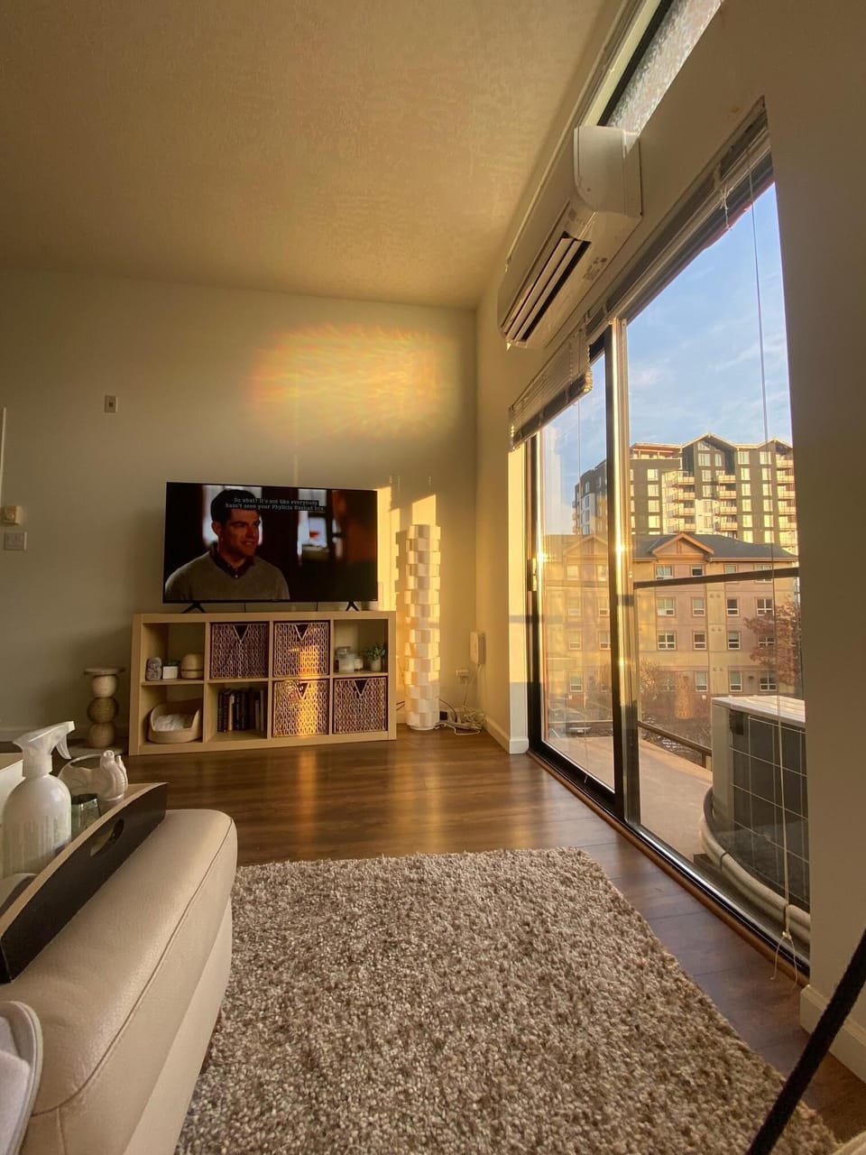 Living room with sunset views through floor-to-ceiling glass patio doors.