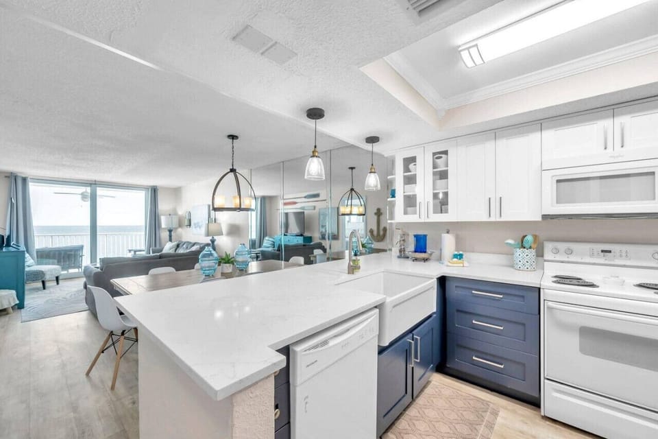 Spacious kitchen w/ large island, bar seating, and an open flow to the living space.