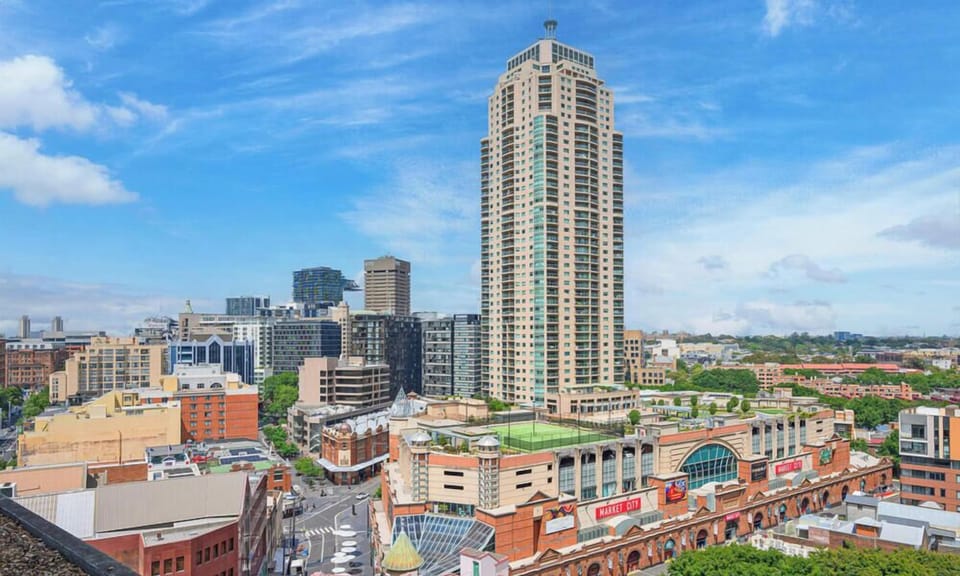 Elevated city view showcasing surrounding skyline and nearby buildings.