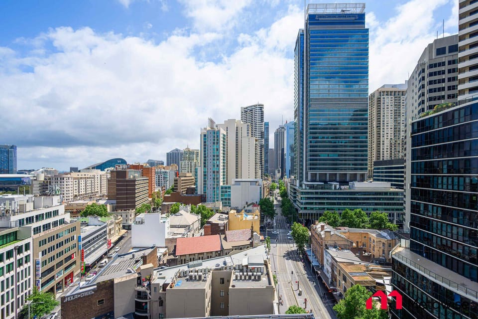 Another city perspective highlighting nearby commercial towers and urban scenery.