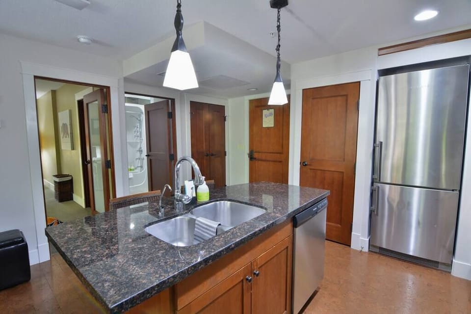 The kitchen also features a well-sized refrigerator for convenient in-home dining and convenient sink for meal prep and cleanup!