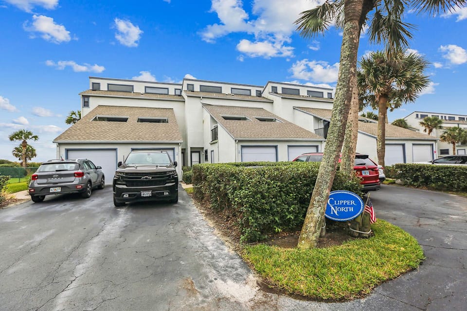 - Convenient parking with easy access to your coastal condo stay  
- Bright exterior welcomes you with charm and tropical atmosphere  
- Smooth arrivals and quick trips to beach make vacations simple  

