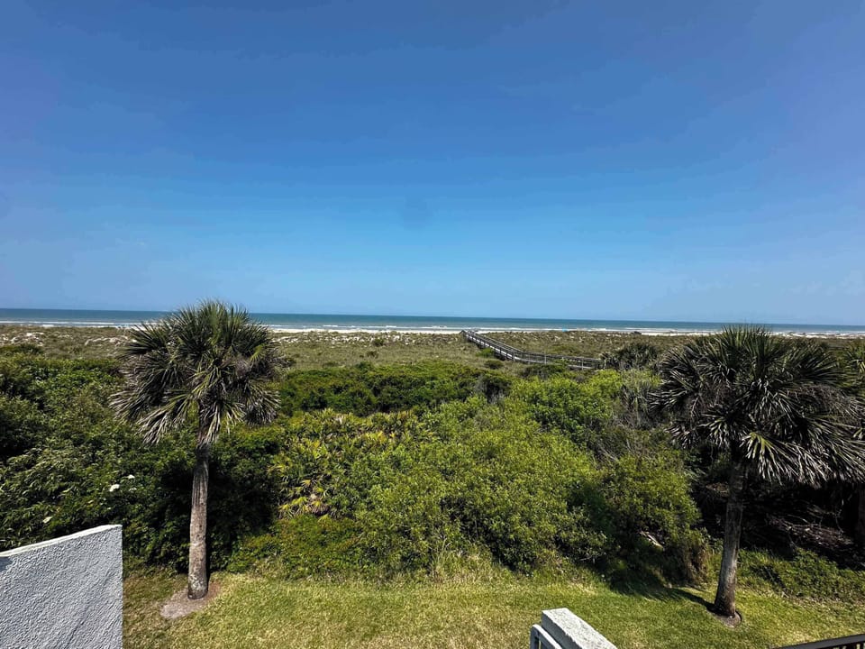 - Stunning view across dunes with ocean waves in the background  
- Nature framed horizon creates a calm and inspiring backdrop  
- Relax enjoy fresh breezes and take in peaceful coastal beauty  
