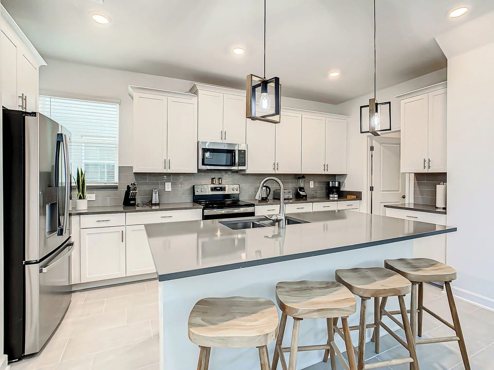 Modern Kitchen with Island Seating and Stainless Steel Appliances