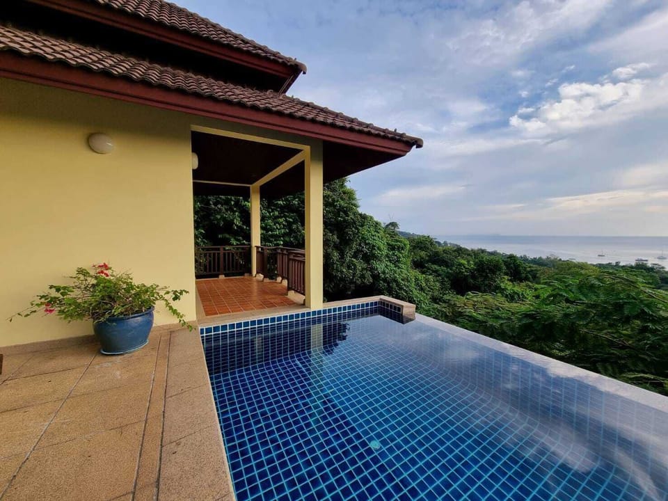 Infinity pool overlooking the Andaman Sea and jungle