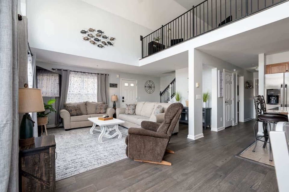 The open concept also connects to the upstairs loft area. The kids can hang out in the loft while the adults enjoy the living room, dining room and kitchen. All the while, you have the peace of mind of keeping an ear out on them.
