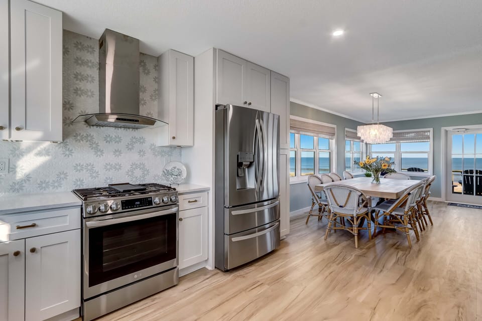 The dining area opens to a magnificent gourmet kitchen ...