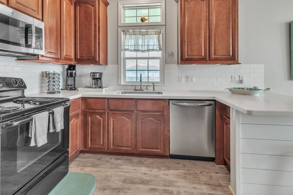 Cook up memories! Our fully stocked kitchen, equipped with a refrigerator, microwave, stove, and oven, sets the stage for delightful culinary experiences.
