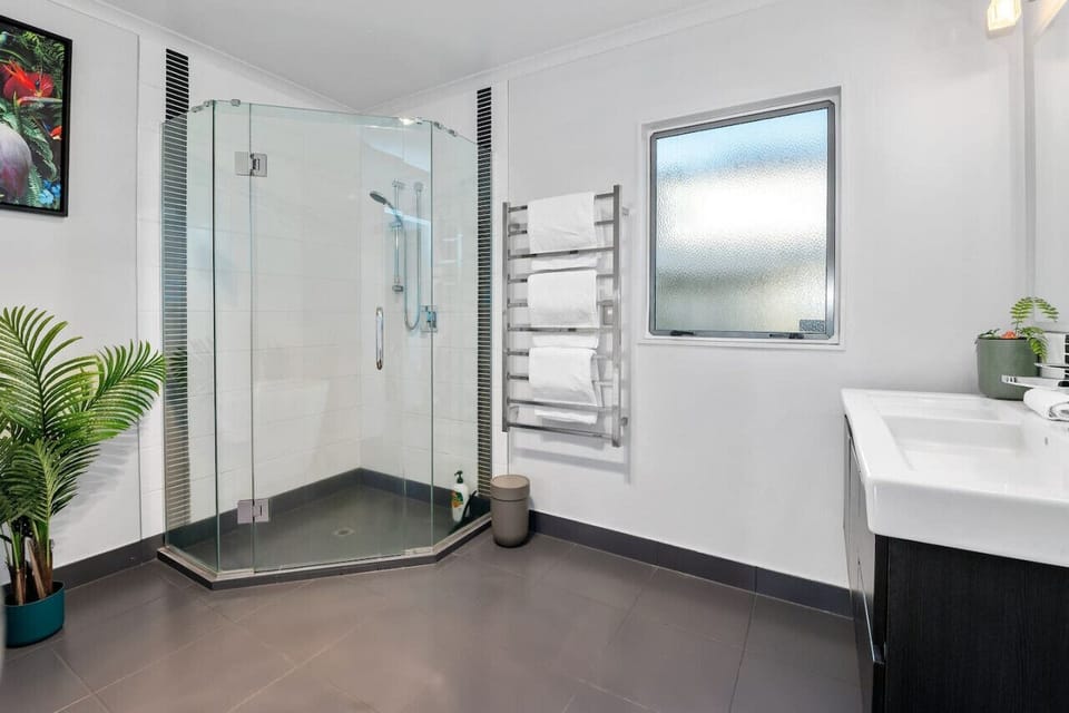 The downstairs bathroom offers both a shower and separate deep bath.