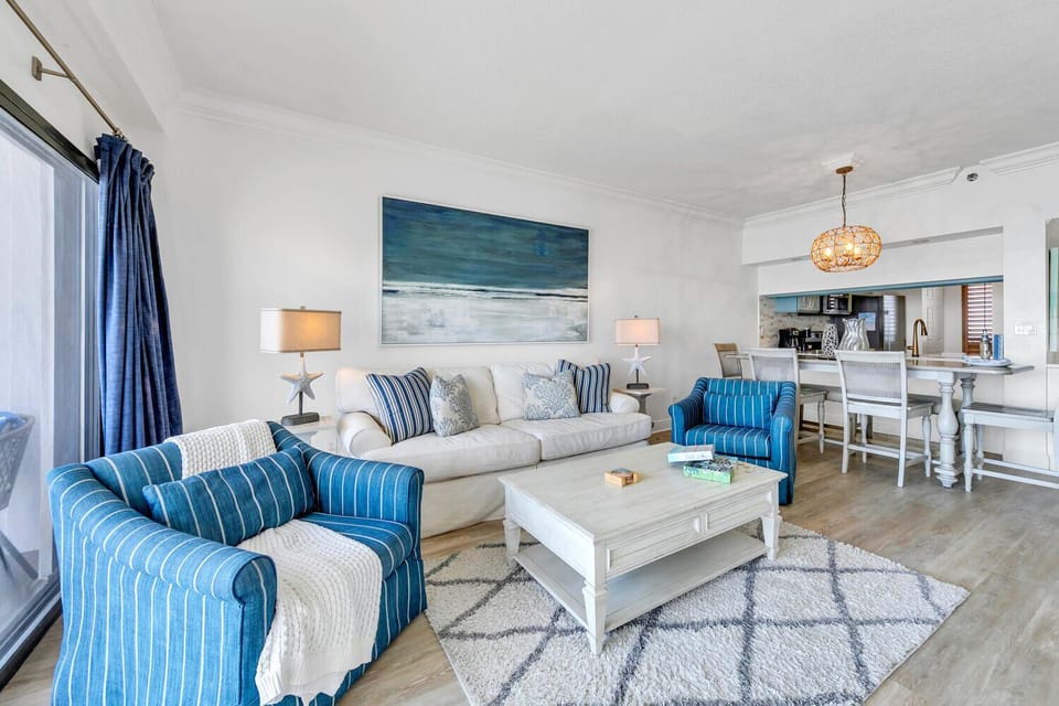Sink into plush coastal comfort with a sleeper sofa and ocean-inspired blues creating your perfect beach escape.