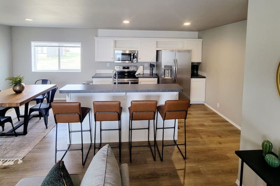 Kitchen island seating and a dining table, perfect for gatherings