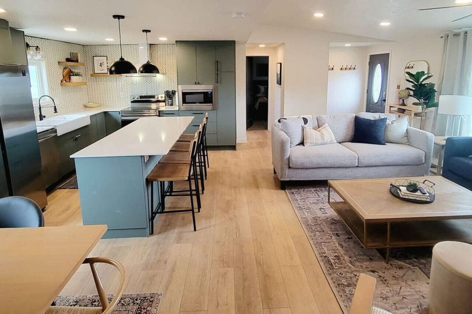 Living room, dining table and kitchen