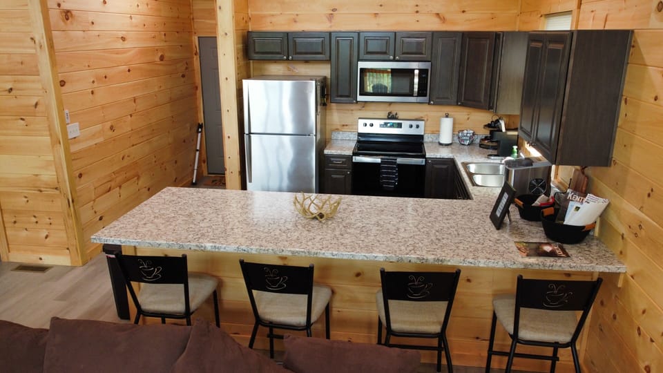 	Kitchen with family gathering island and counter stools