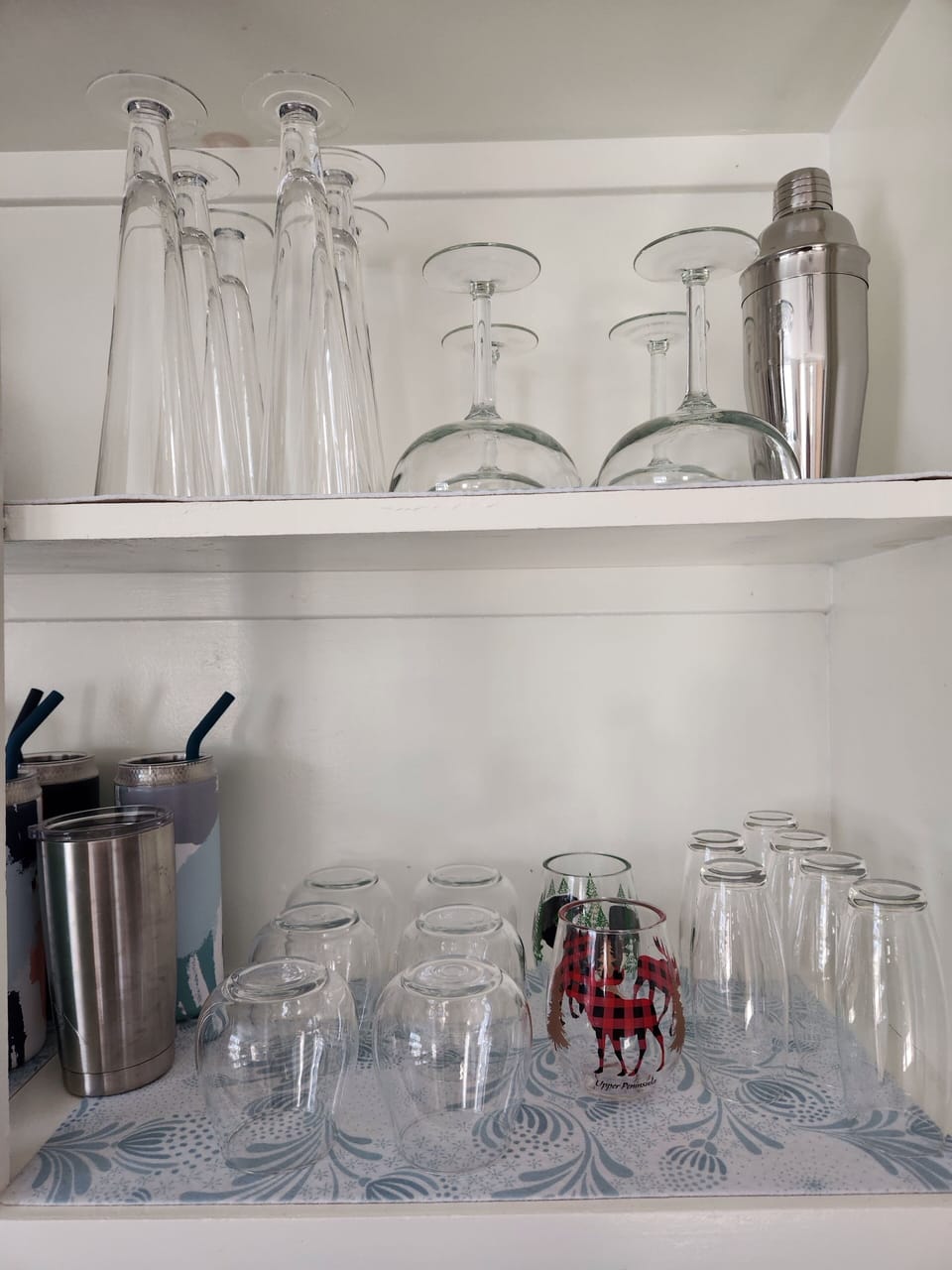 Kitchen is stocked with plenty of indoor and outdoor glassware