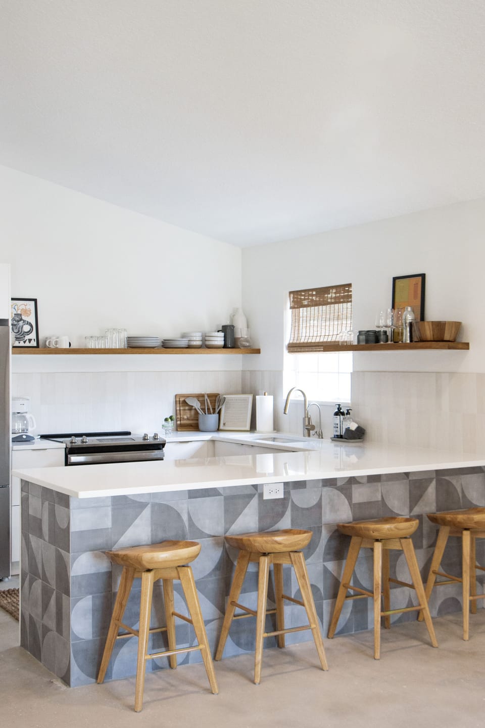 Counter area with four barstools. 