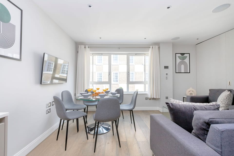 City Apartment | Living area | 40-inch flat-screen TV with satellite channels