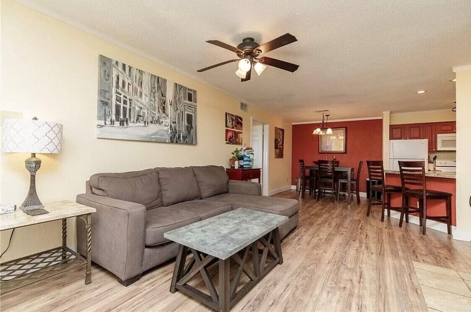 Relax in your spacious open-plan living space featuring comfortable seating, modern decor, and thoughtful touches that make it feel like home.