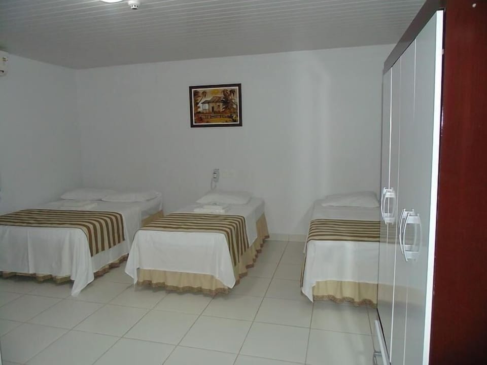 Standard Triple Room | Living area | TV