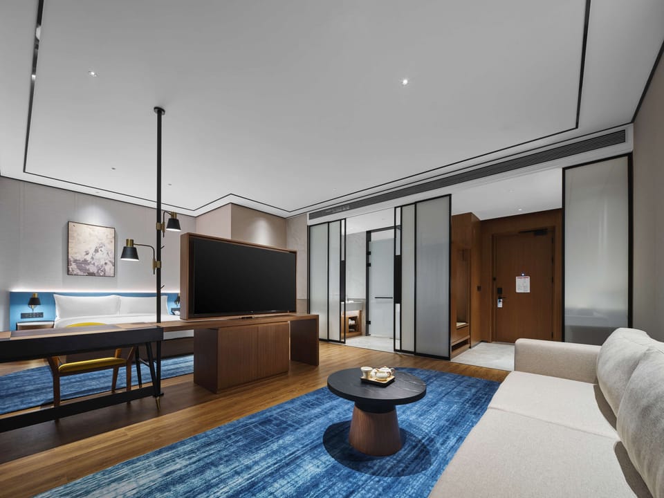 Premium Room, 1 King Bed | Living area | 55-inch flat-screen TV with cable channels