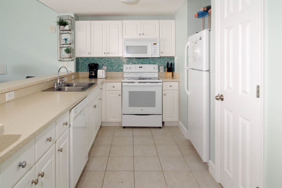 Cook up a seafood dinner on these Corian countertops with lots of kitchen supplies