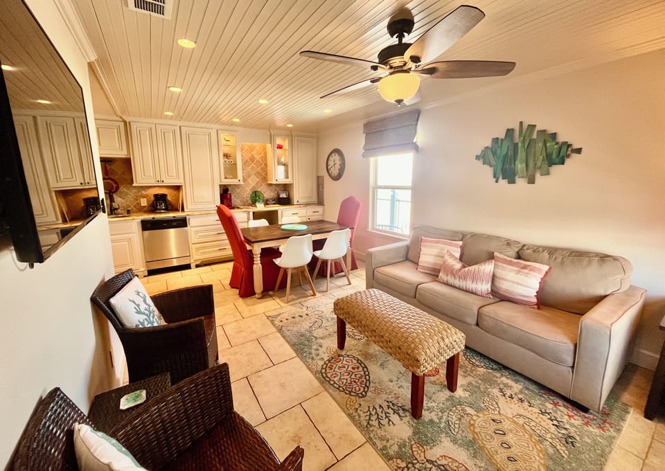 Cozy living area, including full-size pullout couch with new foam mattress.