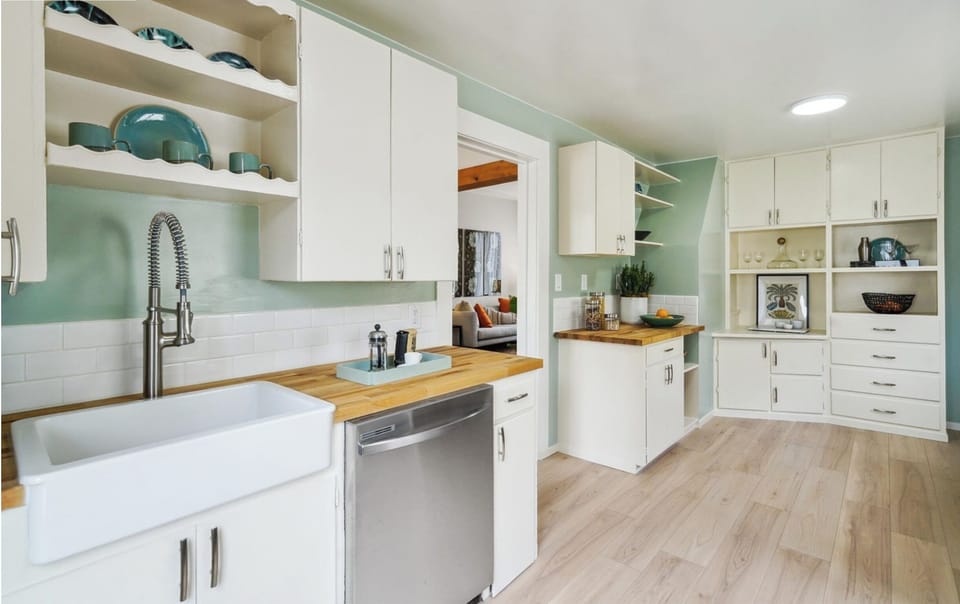 Kitchen sink, espresso machine, toaster, and countertop