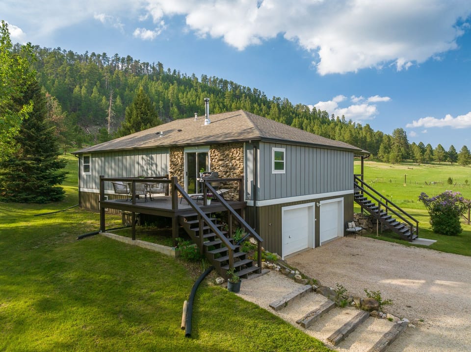 4 bedroom house with outdoor patio and seating