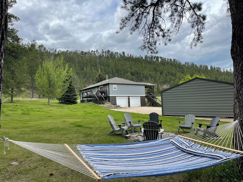 Front yard to relax by the firepit or enjoy the hammock