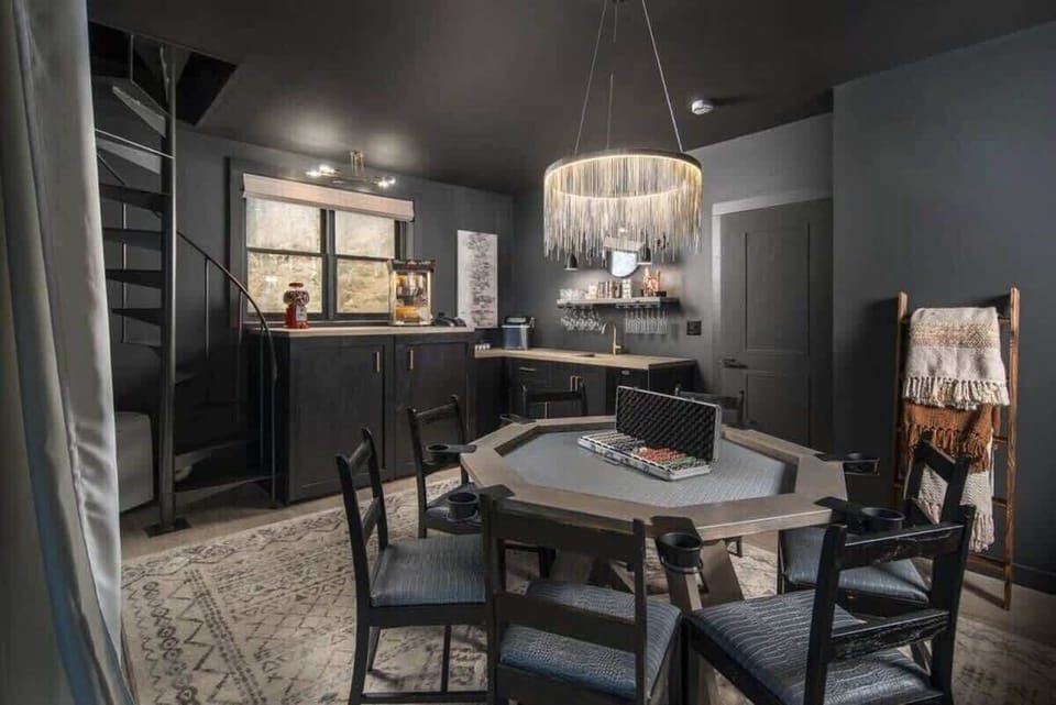 Basement "speakeasy" game room & bar equipped with tons of games, 7-person custom poker table.