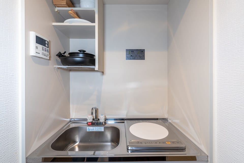 Electric kettle, griddle, cleaning supplies, paper towels