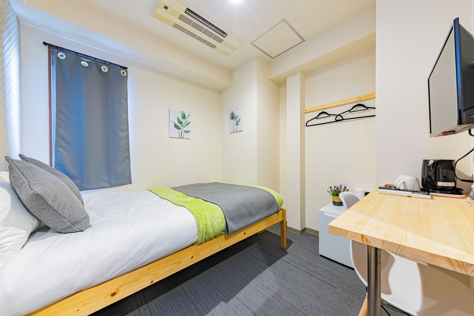 Economy Room | Desk, blackout drapes, free WiFi, bed sheets