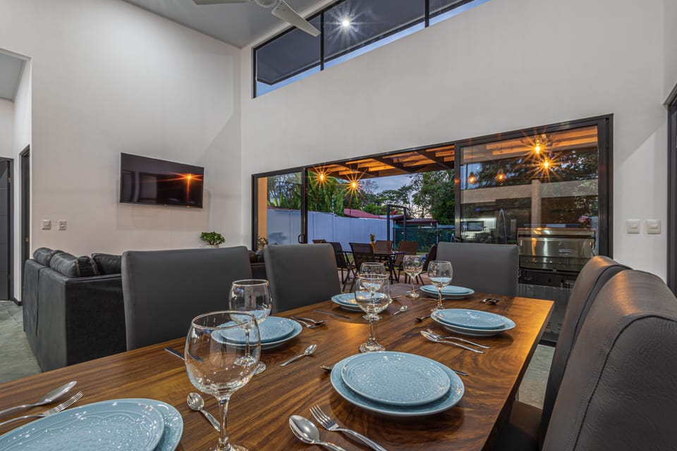 spacious, stylish dining area with modern furnishings and soft lighting.