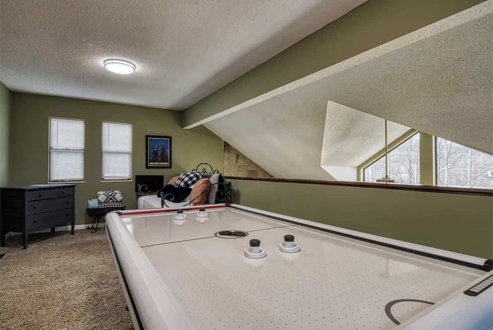 Game Room: Challenge your friends to air hockey in this fun-filled space with natural light!