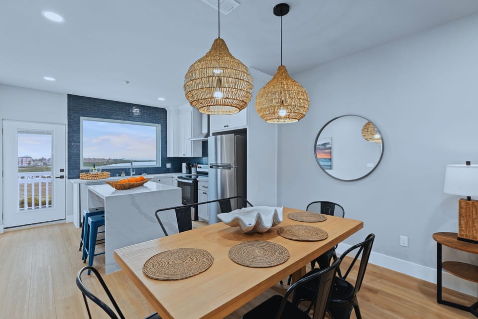 Designed for connection, the open kitchen and dining area offers everything you need to cook together and a cozy nook for sharing meals with a view.