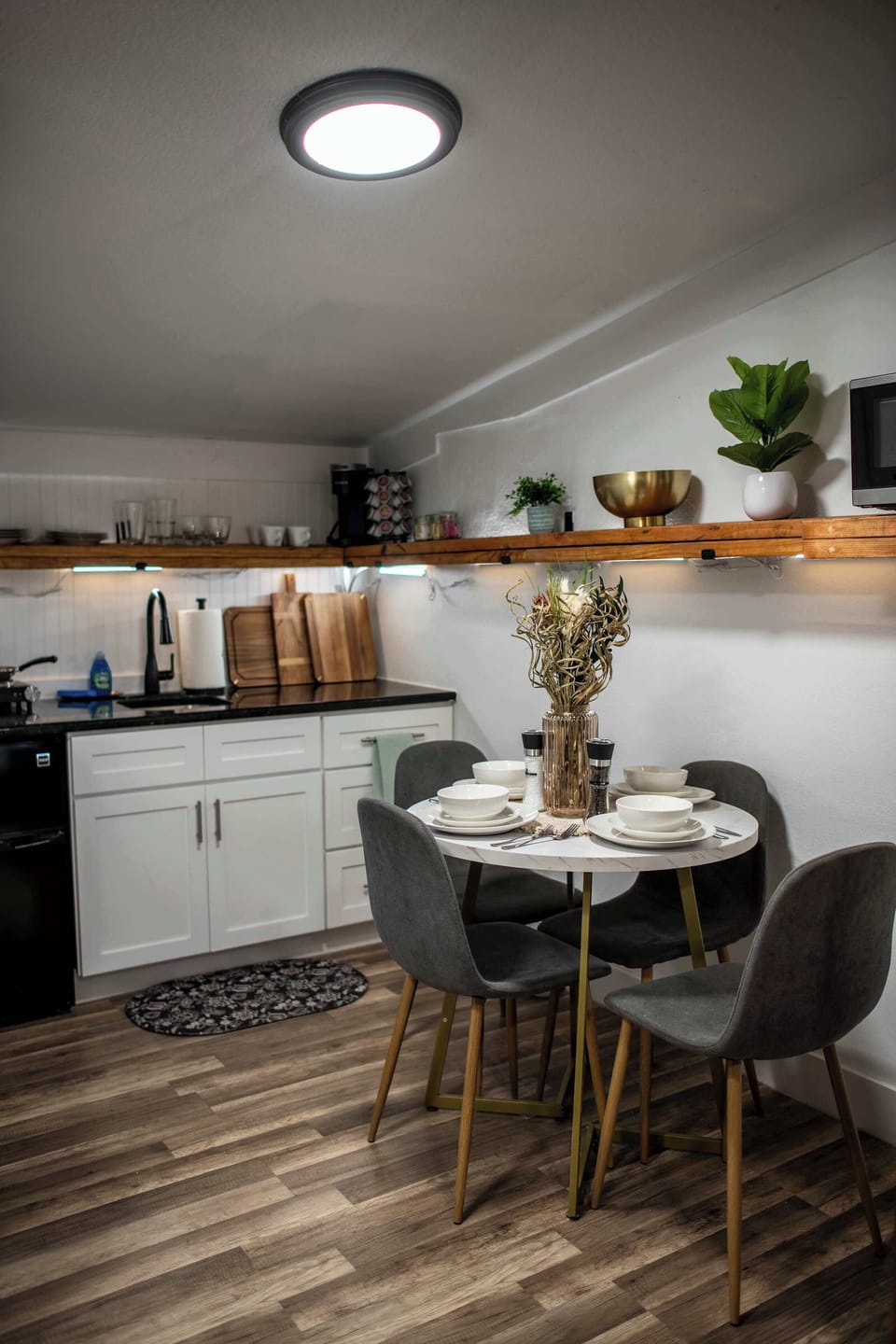 Full kitchen with Stove, Microwave, Fridge, Plates, Pots, and other utensils